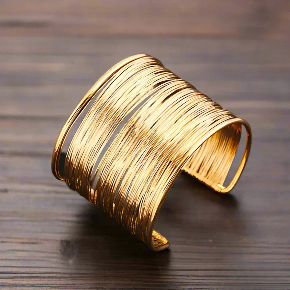 Ouda™ polsino d'oro 1